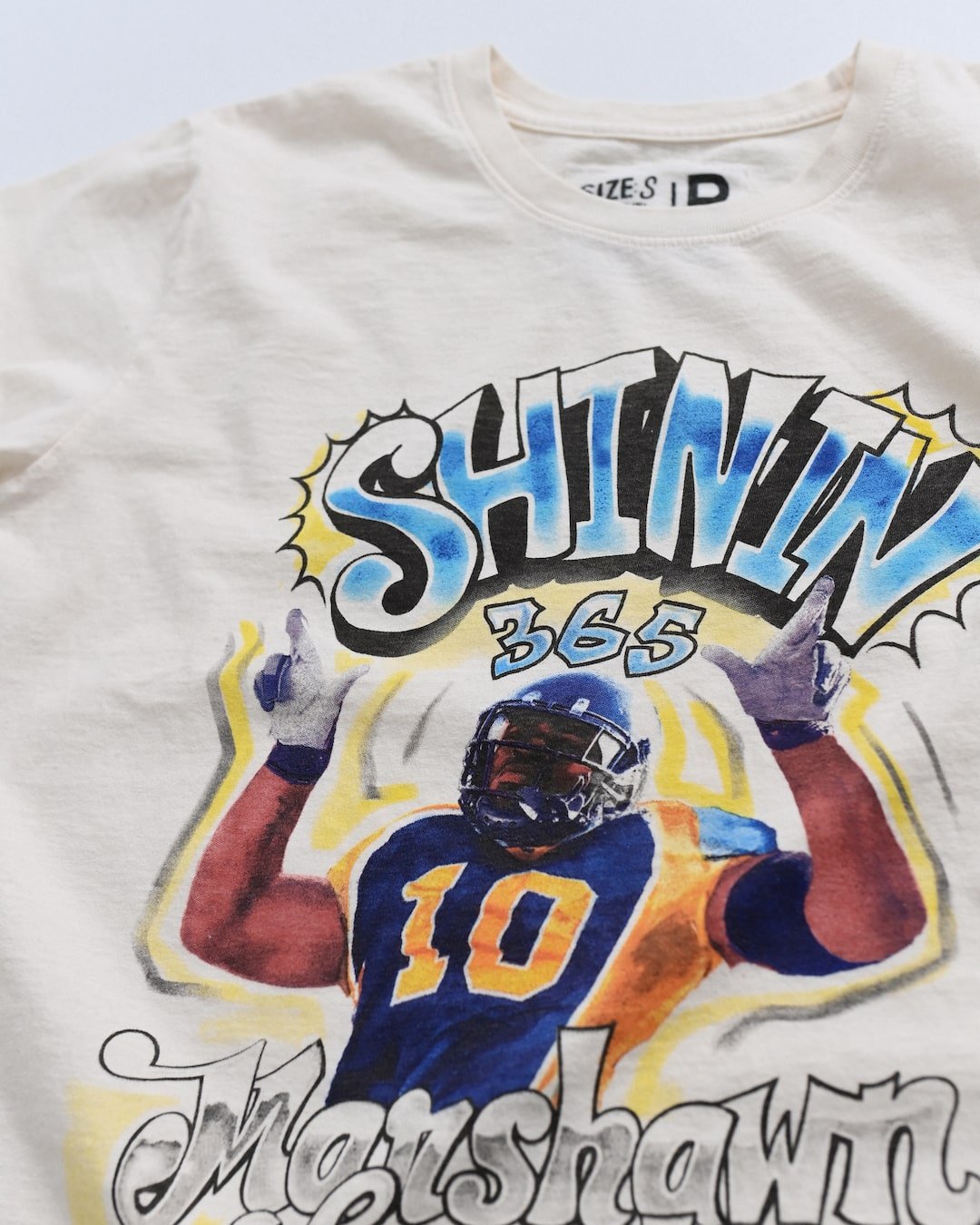 CAL - Marshawn Lynch Shinin' 365 White Tee - Roots of Fight Canada