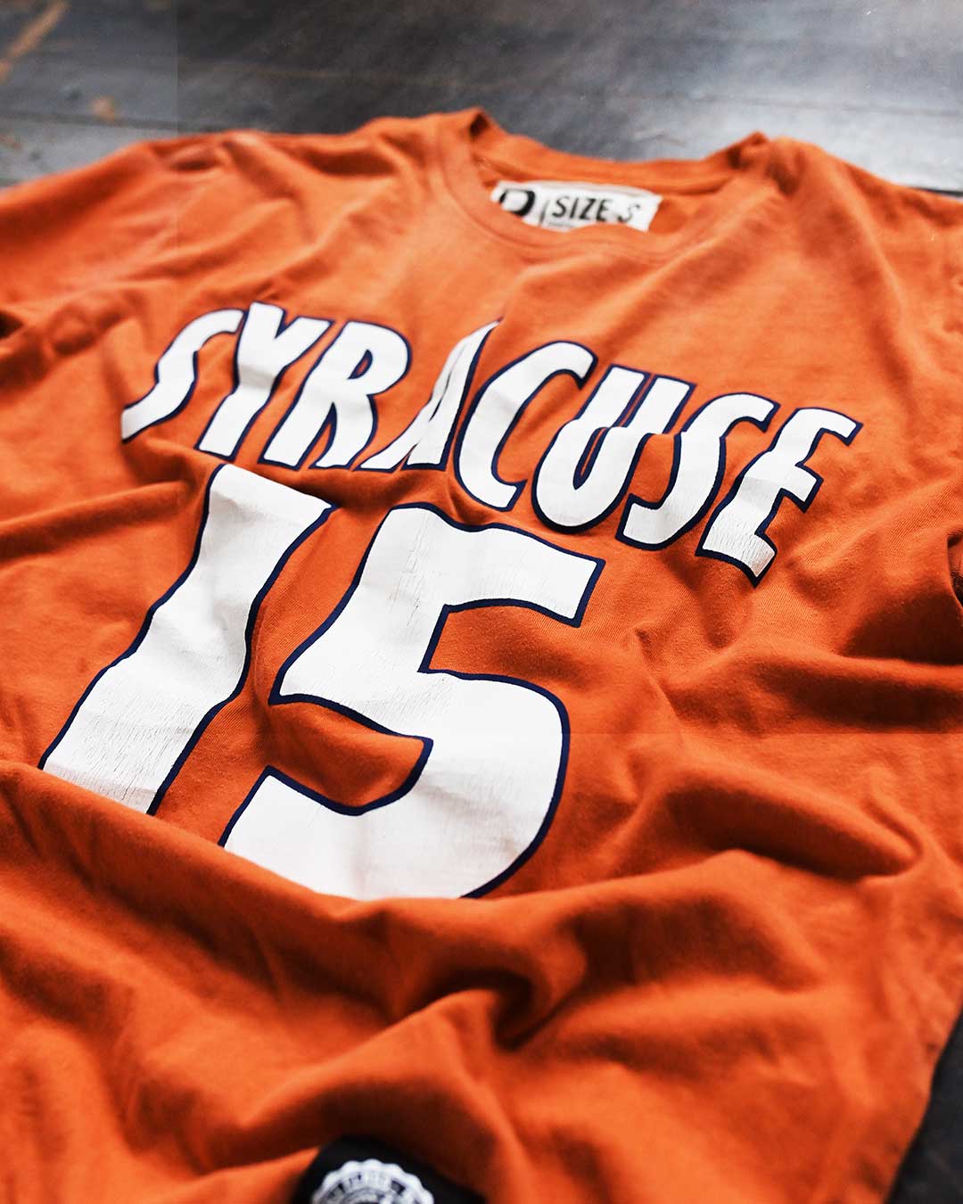 Melo Syracuse #15 Orange Tee - Roots of Fight Canada