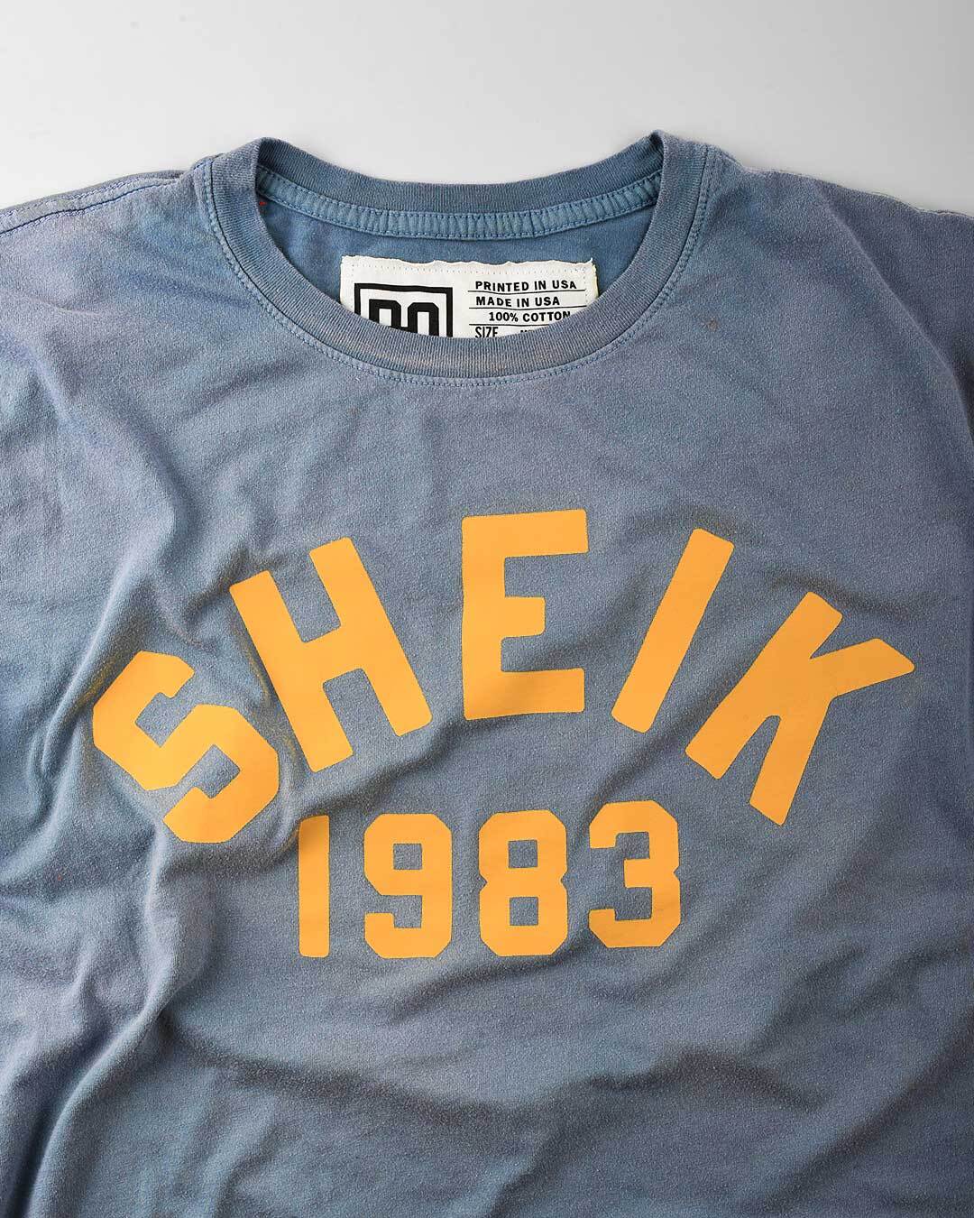 The Iron Sheik 1983 Champ Blue Tee - Roots of Fight